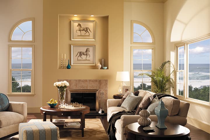 Elegant coastal living room with ocean views, fireplace, and luxury furnishings