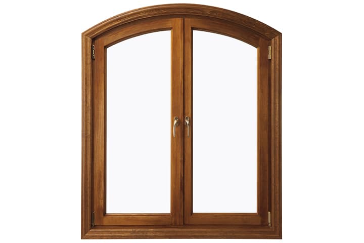Wooden arched double-pane window with brown frame isolated on white